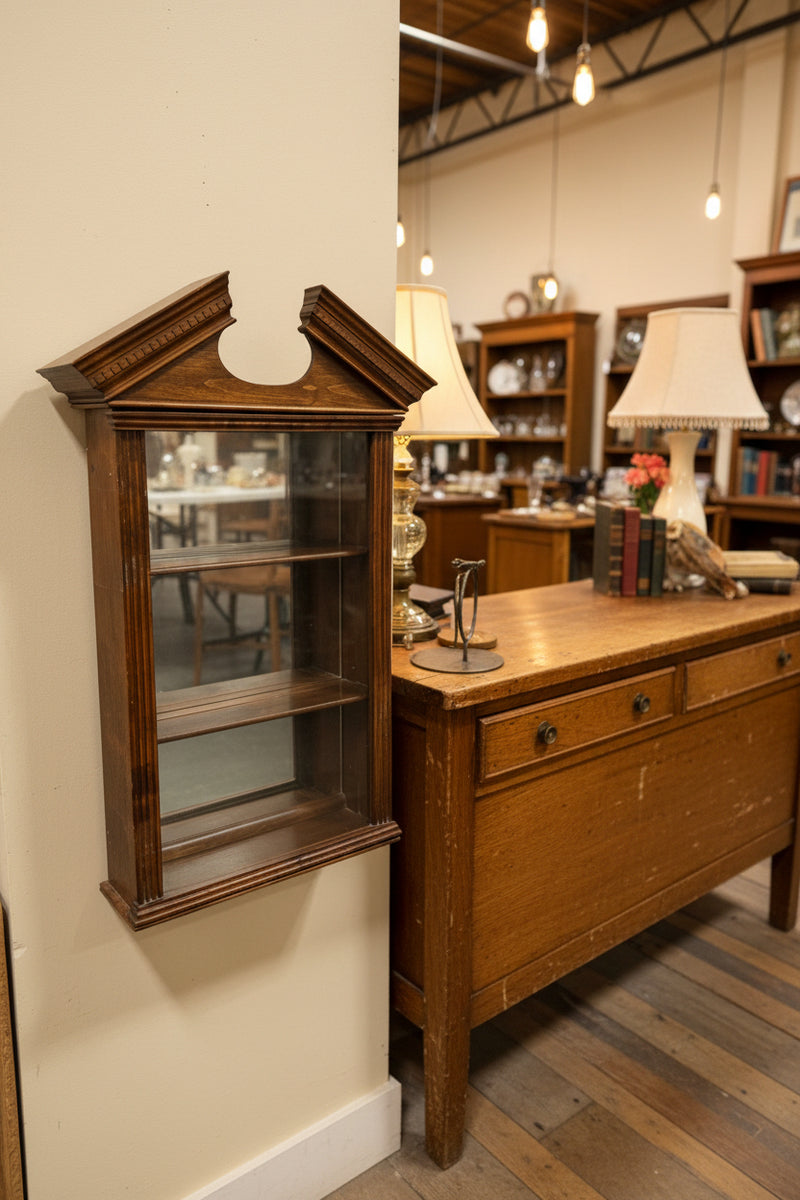 Wall-Hung Glazed Curio Display Cabinet with Broken Pediment and Dentil Cornice, Mirrored Back over Two Shelves, Original Hanging Label, American, c. 1940–1970