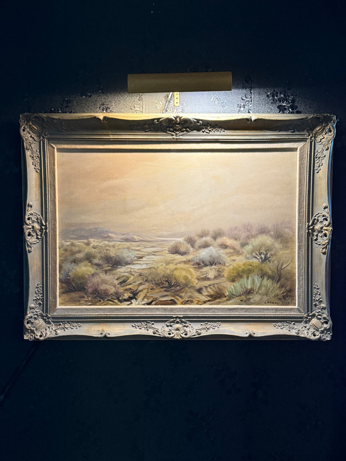 Desert landscape oil on canvas by Alice Cardelli Swett in an ornate Rococo-Revival gilt frame