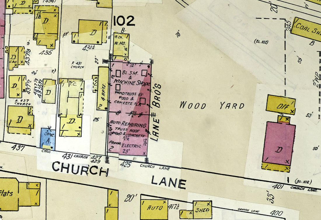 Detail of the 1949 Sanborn fire insurance map of Reno, sheet 4, block 102, showing the LANE BROS building at 425 Church Lane divided into blacksmith and machine shop and auto repairing, with the wood yard and coal shed around it