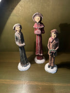 Three Hand-Painted Victorian Caroler Figures, Elongated Folk-Art Modelling with Dry-Brushed Antique Finish, Muffs, Bonnets and a Bell-Hung Wreath, Sold as a Set, c. 1985–2000