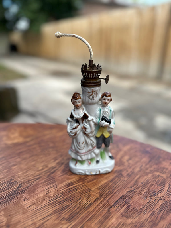 Miniature Figural Oil Lamp, Porcelain Courting Couple Flanking a Gilt Fluted Font, with Original Brass Burner, Continental, c. 1890–1940