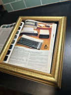 Set of Three Original Atari CX40 Joysticks with Framed Montgomery Ward Catalog Page, c. 1980s | Curated Reductions