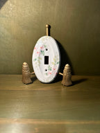 Porcelain Single-Toggle Switch Plate with Pink Dogwood Transfer Decoration, Oval Form, Unused with the Original Screws Still Sealed to the Reverse