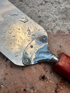 Androck Flexible Stainless Turner with Marbled Red Catalin Handle, Rockford Illinois, c. 1935–1955