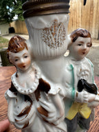 Miniature Figural Oil Lamp, Porcelain Courting Couple Flanking a Gilt Fluted Font, with Original Brass Burner, Continental, c. 1890–1940