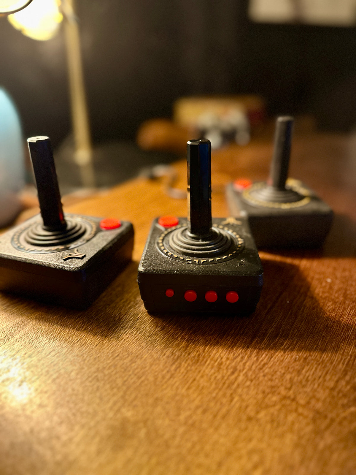 Set of Three Original Atari CX40 Joysticks with Framed Montgomery Ward Catalog Page, c. 1980s | Curated Reductions