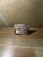 Budweiser Label Belt Buckle, Cast Brass-Finish with Anheuser-Busch Brewery List — Datable to 1972–1976 by the Cities on Its Face