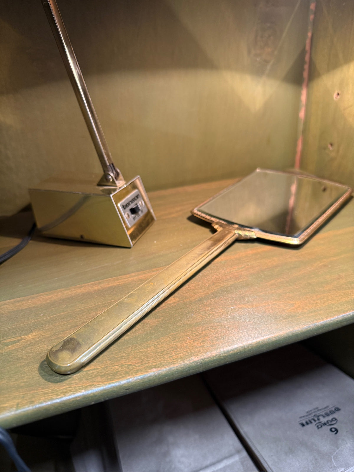 Art Deco Gilt-Metal Hand Mirror, Graduated Green and Cream Enamelled Back with Gold Pinstriping, Stepped Fan Palmette and Reeded Handle, Bevelled Plate, c. 1925–1940