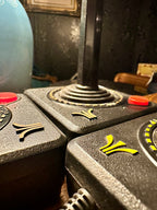 Set of Three Original Atari CX40 Joysticks with Framed Montgomery Ward Catalog Page, c. 1980s | Curated Reductions