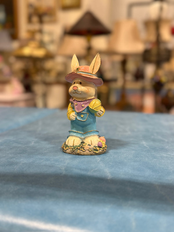 Cold-Painted and Hand-Gilded Easter Rabbit Figure in a Pink Brimmed Hat and Blue Overalls, Standing on a Flowered Base with Eggs, Early to Mid 20th Century