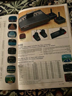Set of Three Original Atari CX40 Joysticks with Framed Montgomery Ward Catalog Page, c. 1980s | Curated Reductions
