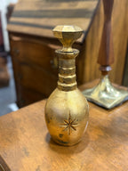 Gold-Finished Ceramic Decanter with Moulded Star Relief and Faceted Stopper, Marked LIQUOR BOTTLE to the Base, American, c. 1965–1985