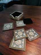 Set of Six Damascene Marquetry and Mother-of-Pearl Coasters with Fitted Caddy, Syria, c. 1940–1970