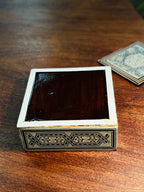 Set of Six Damascene Marquetry and Mother-of-Pearl Coasters with Fitted Caddy, Syria, c. 1940–1970