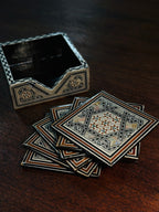 Set of Six Damascene Marquetry and Mother-of-Pearl Coasters with Fitted Caddy, Syria, c. 1940–1970