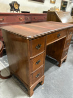 Colonial Revival Kneehole Desk, Seven Drawers with Batwing Brasses and Bracket Feet, Refinished by Walter Hinchman in Sedona Red, Antique Walnut and Mahogany, c. 1940–1955