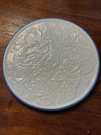 Embossed Rose Ceramic Trivet, Cream Glaze with Cobalt Banded Rim, c. 1940–1970