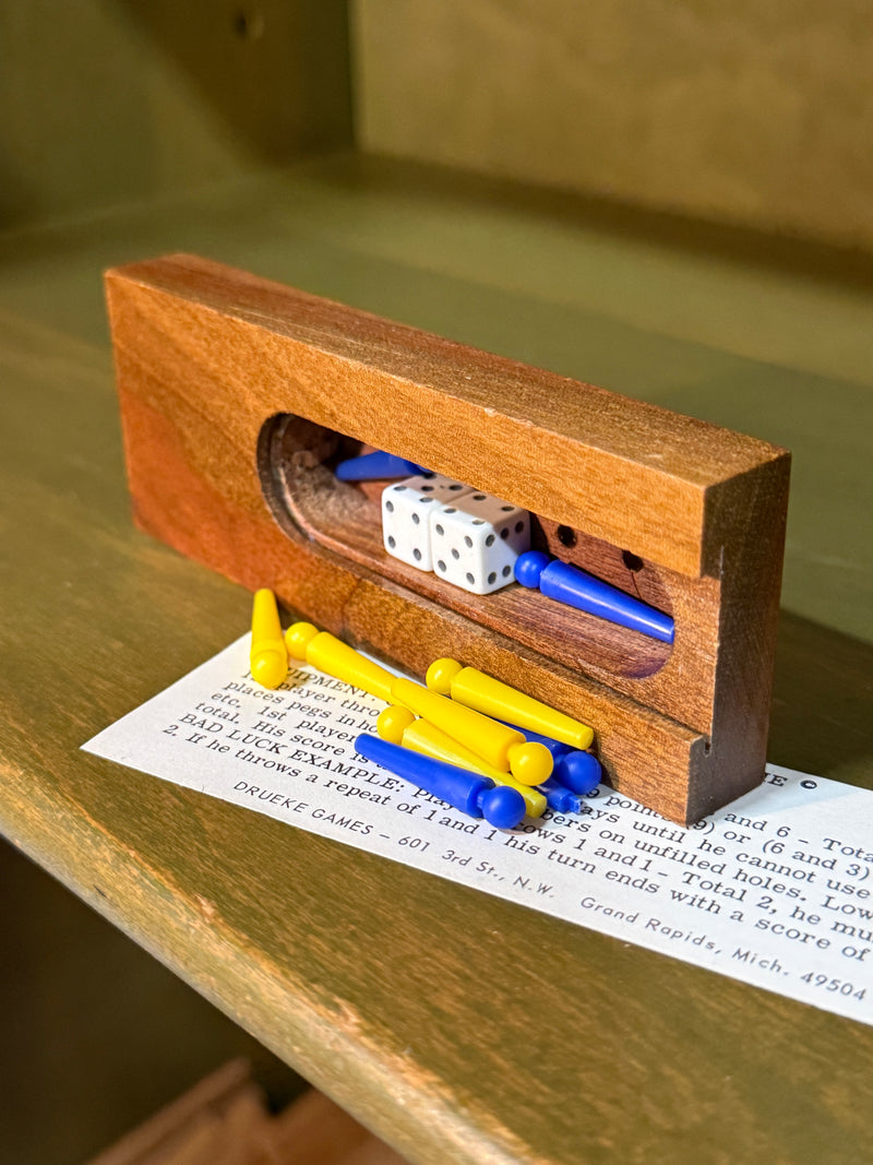 Drueke “Pocket Clapper Game” No. 154, Walnut Dice-and-Peg Game with Original Rules and Case, Grand Rapids, c. 1965–1983