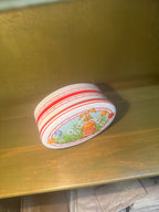 Daher Easter Tin, Oval Lidded Container Lithographed with a Rabbit and Spring Bulbs on Red and White Stripe, English-Made for Daher of Long Island City, c. 1963–1980