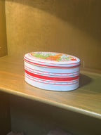 Daher Easter Tin, Oval Lidded Container Lithographed with a Rabbit and Spring Bulbs on Red and White Stripe, English-Made for Daher of Long Island City, c. 1963–1980