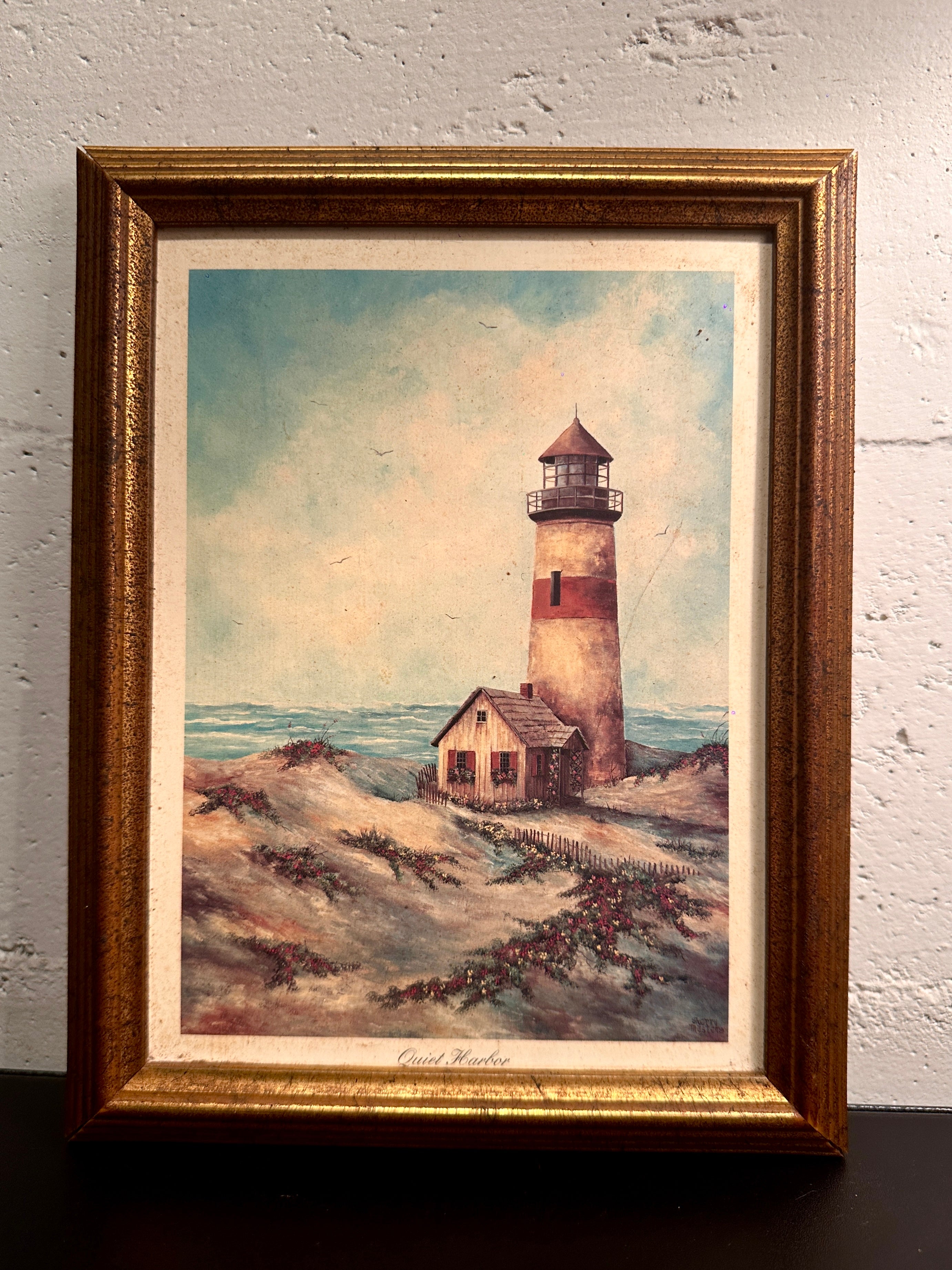 Quiet Harbor & Sandy Pointe Pair of vintage framed lighthouse prints titled Quiet Harbor and Sandy Pointe. Matching coastal artwork set with gilt wood frames, sold together.| Vintage Framed Lighthouse Print Set