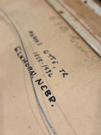 Close-up of a handwritten address on cardboard with 'ELKHORN, NEBR.'